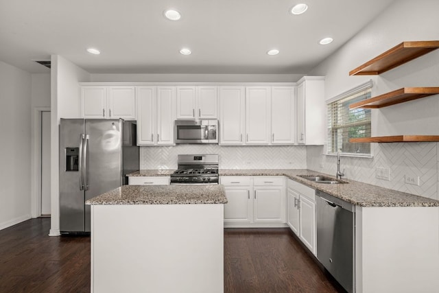 117 Rock Mill Loop, Georgetown, TX 78626 - kitchen featuring stainless steel appliances, a sink, dark wood-style flooring, white cabinets, and recessed lighting