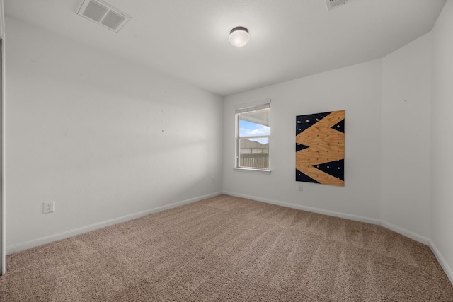 carpeted empty room with baseboards and visible vents