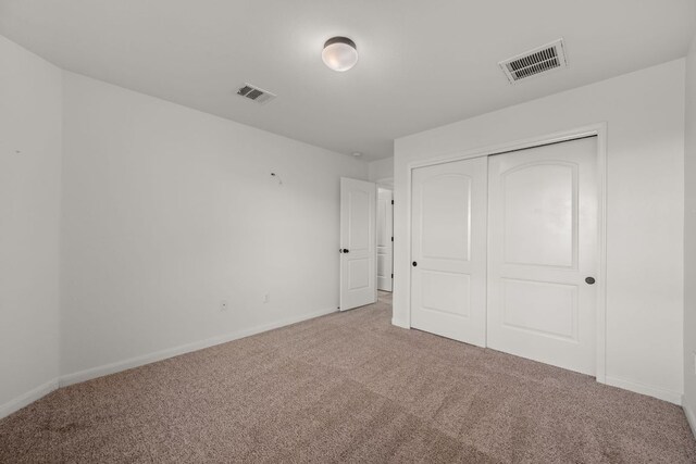 117 Rock Mill Loop, Georgetown, TX 78626 - unfurnished bedroom with carpet, baseboards, and a closet