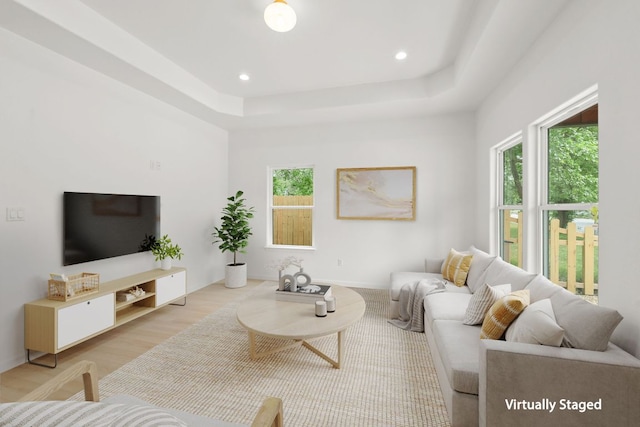 living room featuring recessed lighting, a wealth of natural light, and wood finished floors