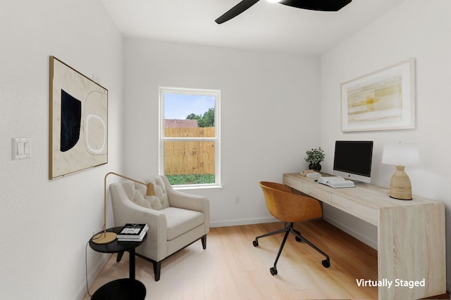 office space featuring baseboards, wood finished floors, and ceiling fan