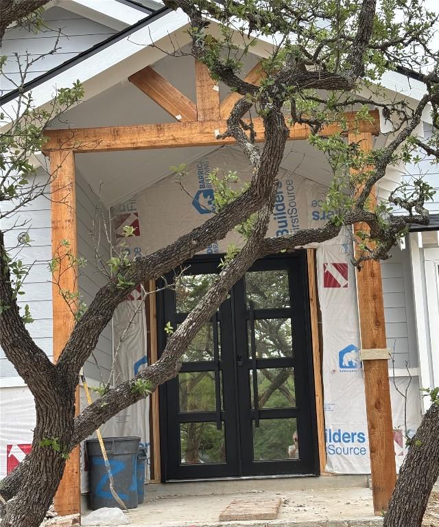 view of exterior entry featuring french doors