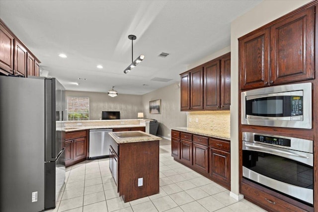 kitchen with recessed lighting, light tile patterned floors, appliances with stainless steel finishes, backsplash, and visible vents
