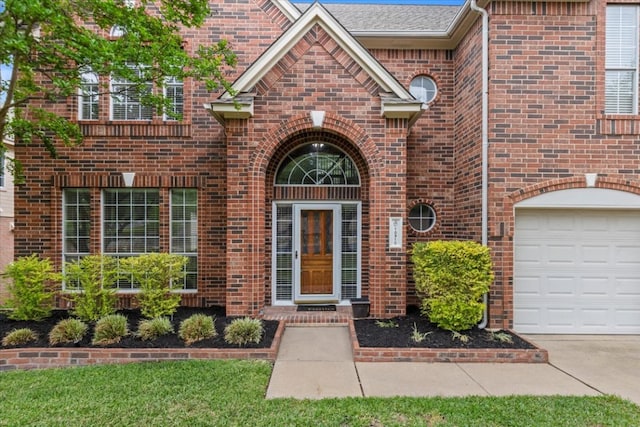 property entrance featuring brick siding