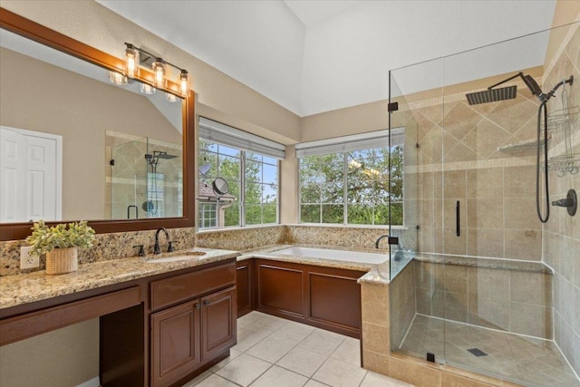 full bath featuring tile patterned floors, a stall shower, a garden tub, and vanity