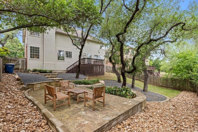 view of yard with stairs, a fenced backyard, and a patio area
