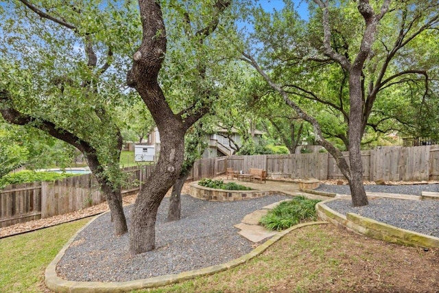 view of yard featuring a patio area and a fenced backyard