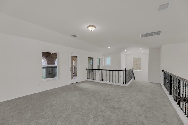 carpeted spare room featuring visible vents and recessed lighting