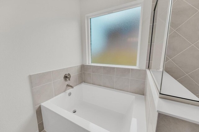 bathroom featuring a bath