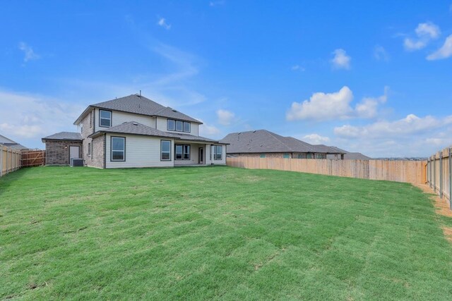 4847 Padula Dr, Round Rock, TX 78665 - rear view of property featuring a fenced backyard and roof with shingles