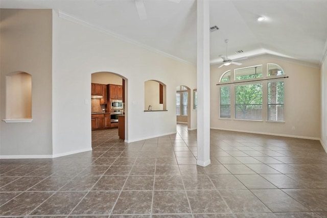 2213 Settlers Park Loop, Round Rock, TX 78665 - unfurnished living room featuring ceiling fan, lofted ceiling, dark tile patterned floors, baseboards, and crown molding