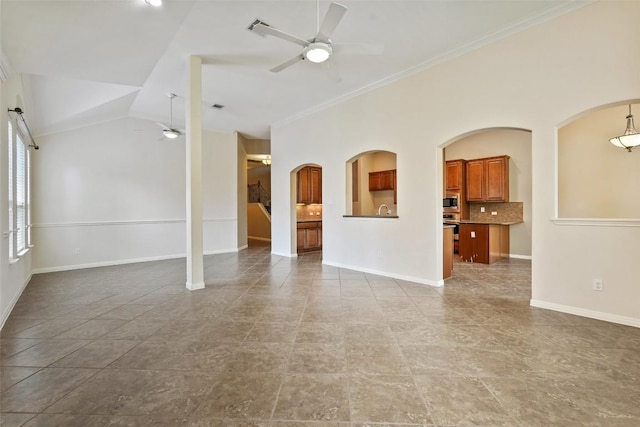 2213 Settlers Park Loop, Round Rock, TX 78665 - spare room featuring ceiling fan, ornamental molding, baseboards, arched walkways, and a sink