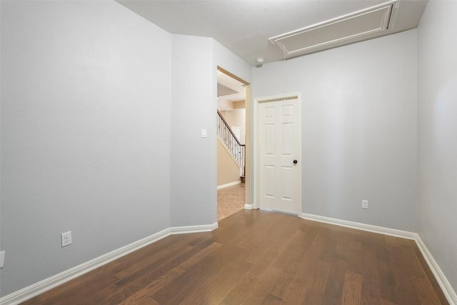 2213 Settlers Park Loop, Round Rock, TX 78665 - empty room featuring attic access, wood finished floors, and baseboards