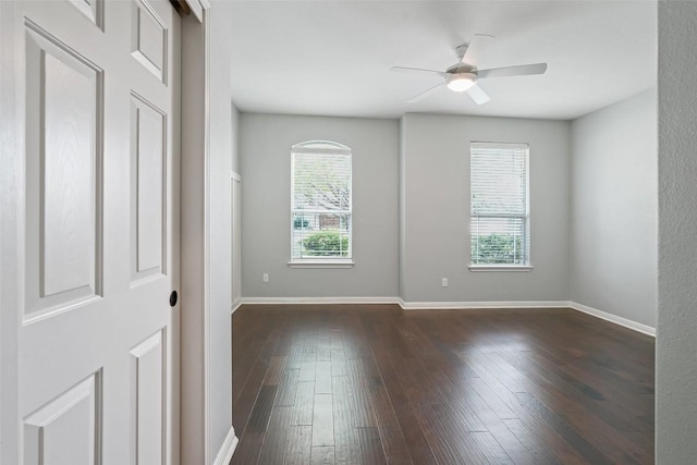 2213 Settlers Park Loop, Round Rock, TX 78665 - empty room featuring a ceiling fan, dark wood-style flooring, and baseboards