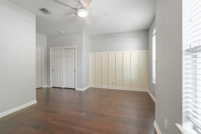 2213 Settlers Park Loop, Round Rock, TX 78665 - unfurnished room with a ceiling fan, dark wood-style flooring, and baseboards