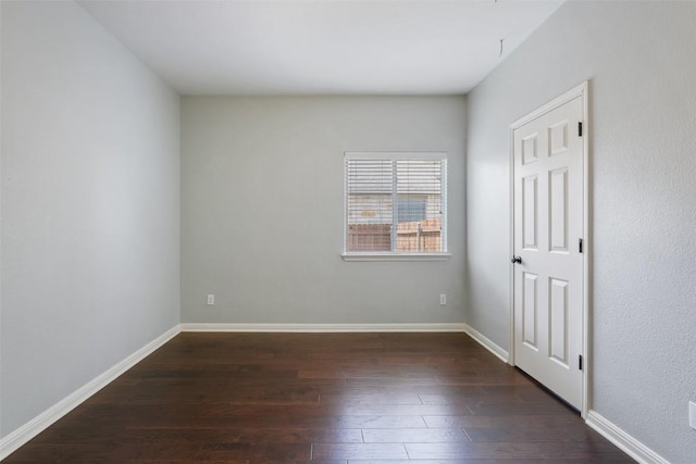 2213 Settlers Park Loop, Round Rock, TX 78665 - spare room featuring dark wood finished floors and baseboards