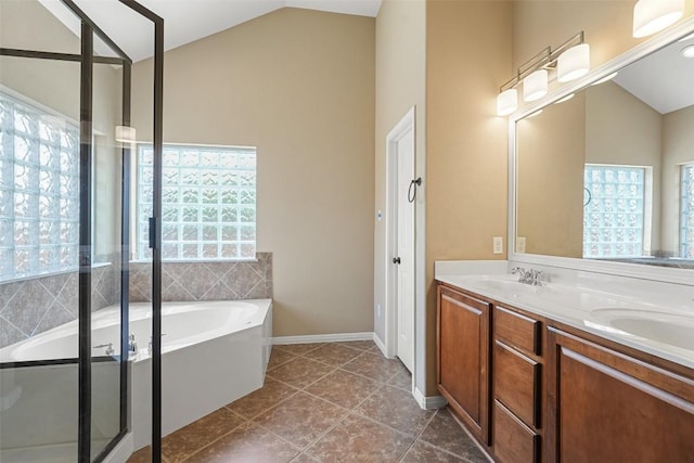 2213 Settlers Park Loop, Round Rock, TX 78665 - bathroom with a bath, vaulted ceiling, double vanity, tile patterned flooring, and a shower with door