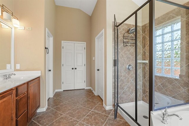2213 Settlers Park Loop, Round Rock, TX 78665 - full bath featuring a stall shower, vanity, a garden tub, and vaulted ceiling