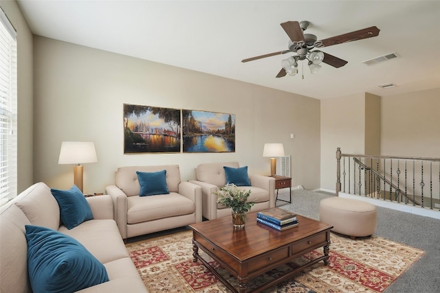2213 Settlers Park Loop, Round Rock, TX 78665 - living room with light carpet, a ceiling fan, and baseboards