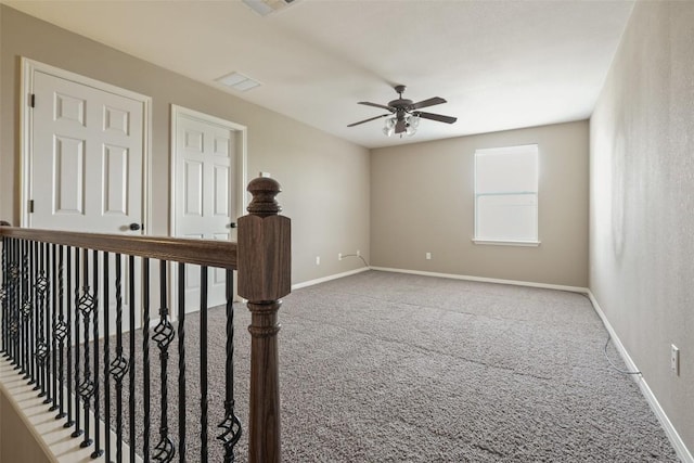2213 Settlers Park Loop, Round Rock, TX 78665 - empty room with carpet flooring, ceiling fan, and baseboards