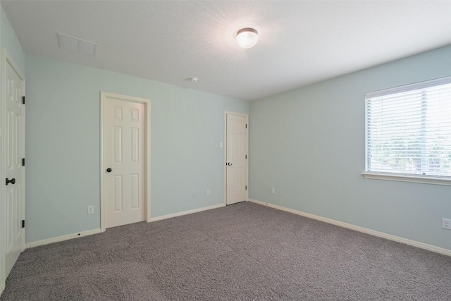 2213 Settlers Park Loop, Round Rock, TX 78665 - unfurnished bedroom featuring carpet and baseboards
