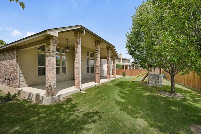 2213 Settlers Park Loop, Round Rock, TX 78665 - view of side of property with a patio, a ceiling fan, and brick siding