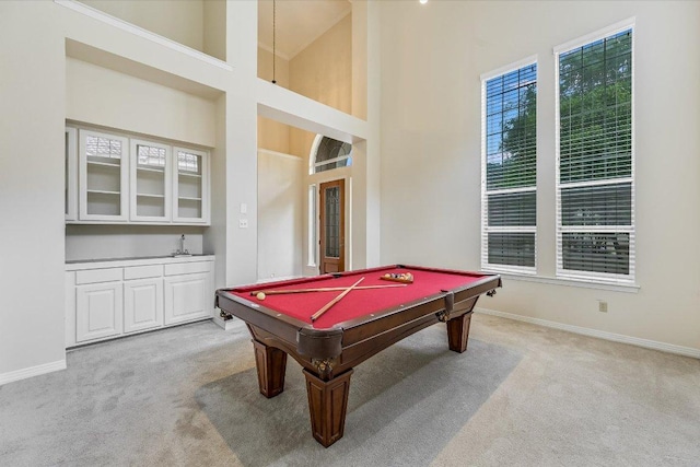 game room with plenty of natural light, pool table, baseboards, and light carpet