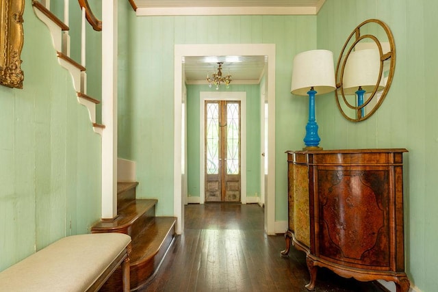 interior space featuring stairs, hardwood / wood-style flooring, baseboards, ornamental molding, and french doors