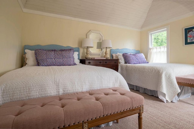 bedroom with vaulted ceiling and carpet floors