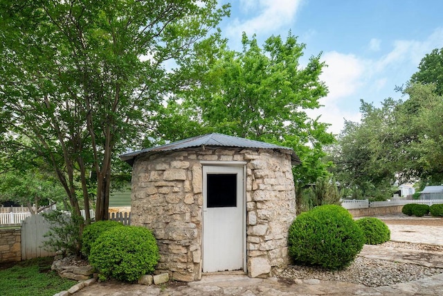 view of outdoor structure with an outdoor structure and fence