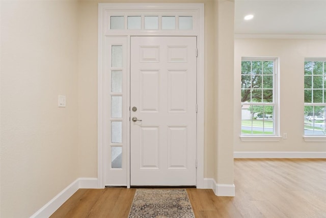 204 San Saba Dr, Georgetown, TX 78633 - entrance foyer with crown molding, baseboards, and light wood-type flooring