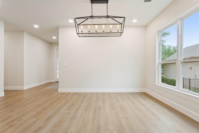 204 San Saba Dr, Georgetown, TX 78633 - unfurnished dining area with recessed lighting, baseboards, a chandelier, and light wood-style floors
