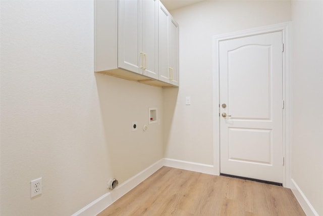 204 San Saba Dr, Georgetown, TX 78633 - laundry area with cabinet space, hookup for a washing machine, light wood-style flooring, electric dryer hookup, and baseboards