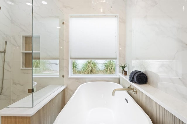 204 San Saba Dr, Georgetown, TX 78633 - bathroom featuring a freestanding bath