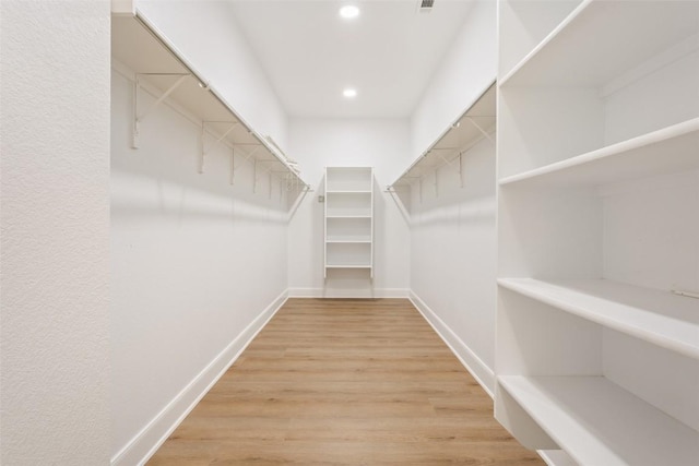 204 San Saba Dr, Georgetown, TX 78633 - walk in closet with wood finished floors