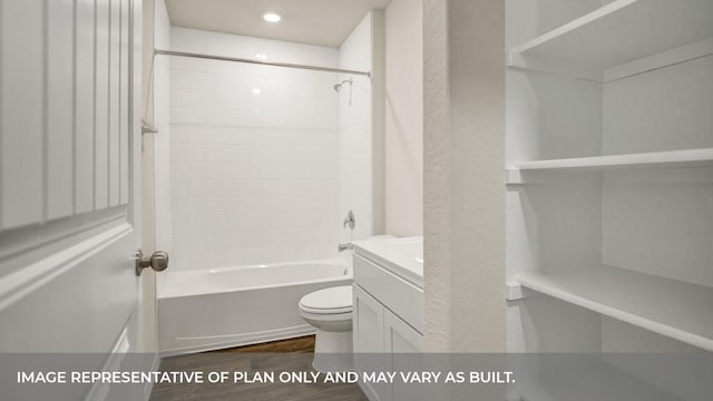 bathroom with wood finished floors, toilet, shower / bathtub combination, and vanity