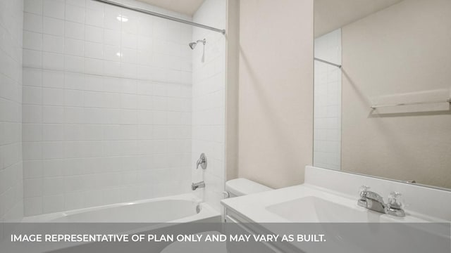 bathroom featuring toilet, bathtub / shower combination, and vanity