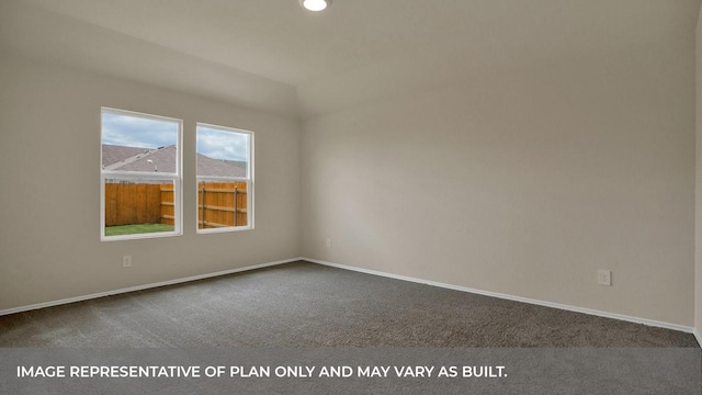 spare room featuring dark carpet, recessed lighting, and baseboards