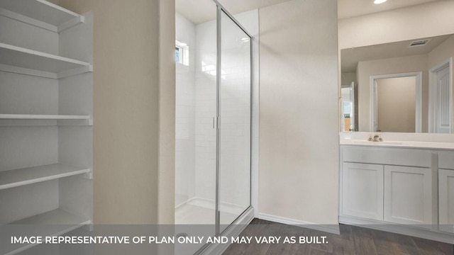 bathroom featuring recessed lighting, a shower stall, vanity, visible vents, and wood finished floors