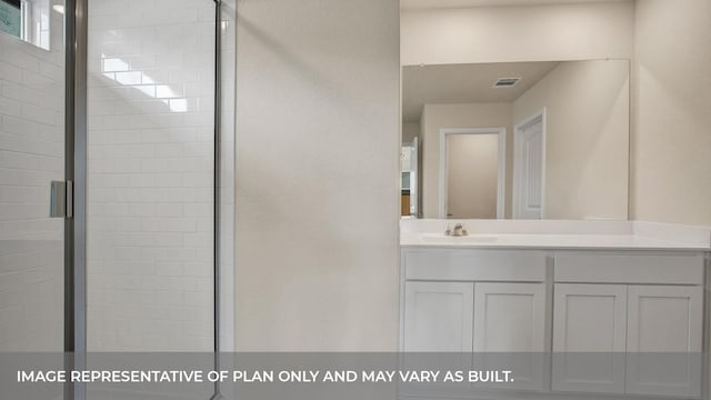 bathroom featuring visible vents, a shower stall, and vanity