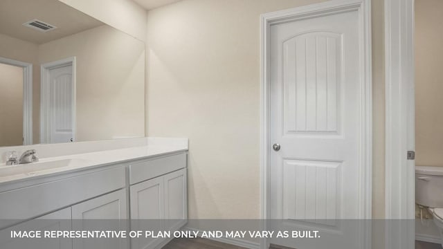 bathroom with visible vents, toilet, and vanity