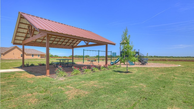 communal playground with a lawn and a gazebo