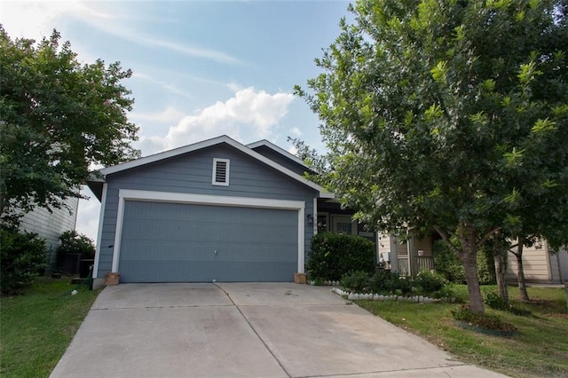 view of front of home with concrete driveway and a garage