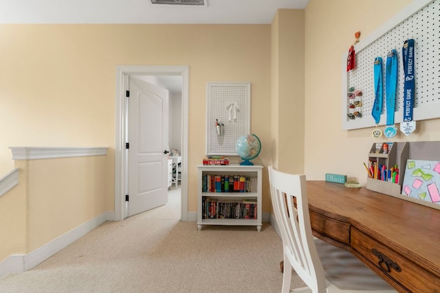 carpeted office featuring baseboards and visible vents