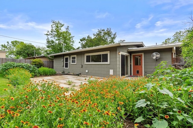 back of house with a patio area and fence