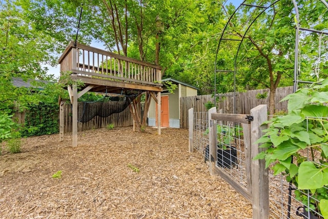 view of yard featuring a wooden deck and a fenced backyard