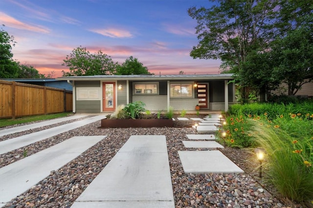 view of front of house featuring fence
