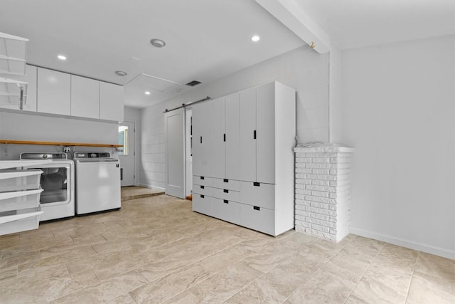 laundry area with a barn door, recessed lighting, washing machine and clothes dryer, and laundry area