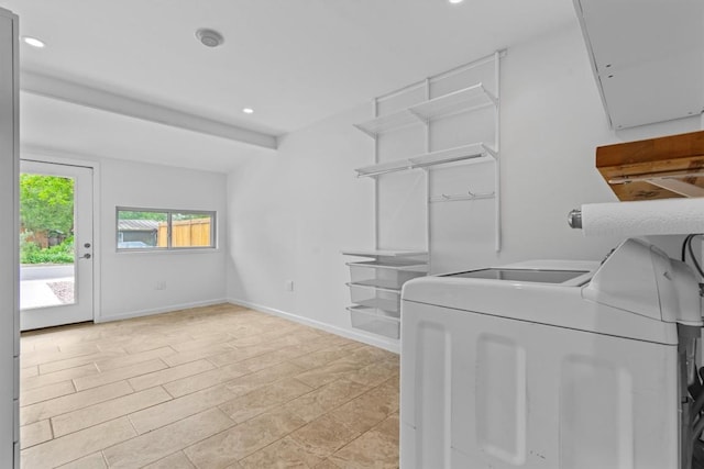 clothes washing area featuring separate washer and dryer, baseboards, laundry area, and recessed lighting