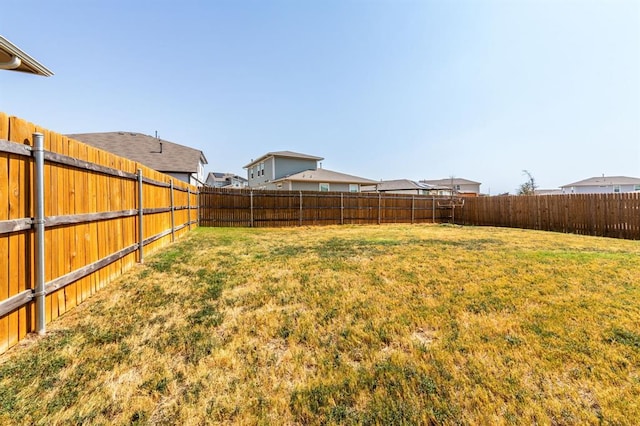view of yard featuring a fenced backyard